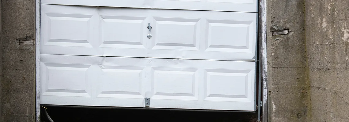 Garage Door Got Hit By A Car Dent Removal in Titusville, FL